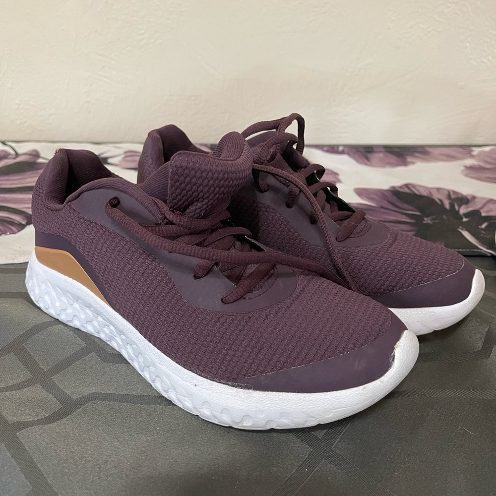 Athletic works, plum purple with gold and white.